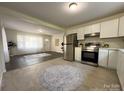 Open floor plan features a bright living room connected to a modern kitchen at 608 E 11Th St, Newton, NC 28658