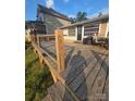 Spacious wooden deck with railing, offering a perfect spot for outdoor entertaining or relaxing in a serene setting at 690 Lake Head Rd # 132, Norwood, NC 28128