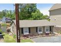 Inviting single-story home with a lake view, featuring window boxes and a welcoming entrance at 690 Lake Head Rd # 132, Norwood, NC 28128