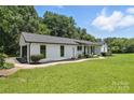 Well-maintained home with landscaped yard and appealing curb appeal at 7109 Forney Hill Rd, Denver, NC 28037
