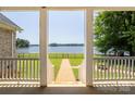 Picturesque backyard with lake views and a well-manicured lawn at 735 Pebble Pt, Salisbury, NC 28146