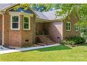 Close up showcasing the brick exterior and manicured landscaping, offering charm and sophistication at 229 Campsite Rd, Rock Hill, SC 29732