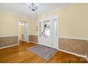 Inviting foyer with decorative front door, beautiful hardwood floors, and neutral paint palette at 229 Campsite Rd, Rock Hill, SC 29732