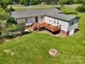 A home with a spacious wooden deck for outdoor entertaining and relaxation at 329 W Red Cross Rd, Oakboro, NC 28129