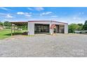 Spacious metal building with multiple bays, offering ample space for storage or workshop activities at 3724 County Home Rd, Conover, NC 28613