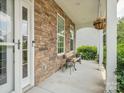 Cozy front porch offers stone accents, space to relax, and a welcoming entrance at 4090 Sunset Dr, Rock Hill, SC 29732