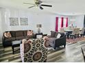Bright and airy living room featuring hardwood floors and comfortable seating arrangements at 1216 Catawba Run, Lowell, NC 28098