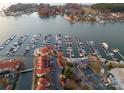 Aerial view of condo complex with marina, boat slips, and ample parking at 17811 Half Moon Ln # E, Cornelius, NC 28031