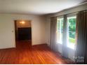 Bright living room featuring hardwood floors and large windows at 1834 Sharonwood Ln, Rock Hill, SC 29732
