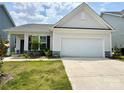 Charming single-Gathering home boasts a two-car garage, manicured lawn, and stylish exterior at 211 Surrey Oak Ln, Charlotte, NC 28216