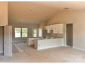 Unfinished, spacious kitchen featuring modern white cabinets, an island, and ample natural light at 3500 14Th Sw Ave, Hickory, NC 28602