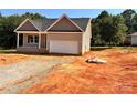 Charming single-Gathering home with a two-car garage and gravel driveway, set against lush trees at 3506 14Th Sw Ave, Hickory, NC 28602