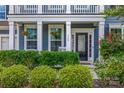 Close up of a front porch featuring flowers and well manicured bushes at 958 Skywater Dr, Fort Mill, SC 29715