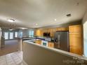 Spacious kitchen with ample cabinetry, stainless steel appliances, and a tile floor at 9730 Elizabeth Townes Ln, Charlotte, NC 28277