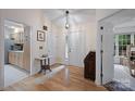 Bright foyer with hardwood floors and neutral walls, showcasing the entrance to the home at 140 Quiet Cove Rd, Mooresville, NC 28117