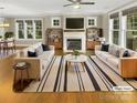 Bright living room with fireplace, neutral tones, and stylish furnishings at 2222 Camp Greene St, Charlotte, NC 28208