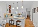 Inviting kitchen with island, barstool seating, stainless appliances and a built-in wine rack at 2358 Sparrow Dr, Rock Hill, SC 29732