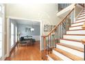 Spacious foyer with wood floors, staircase, and dining area at 3015 Rochester Ct, Monroe, NC 28110