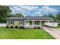 Charming home with well-manicured lawn, landscaping and covered side entrance for convenient parking at 3545 Yorkland Dr, Hickory, NC 28601