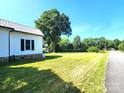 Spacious, flat side yard with well-maintained grass, perfect for outdoor activities and landscaping at 402 Madison St, Lincolnton, NC 28092