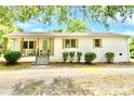 Inviting single-story home with a cozy porch and well-maintained front yard, offering classic charm at 80 Sumner Nw Ave, Concord, NC 28027