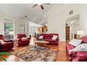 Spacious living room with hardwood floors, a vaulted ceiling, and an open layout at 1036 Foreman Ct, Denver, NC 28037