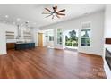 Open living space with hardwood floors, a kitchen island, and sliding doors leading to outdoor patio at 108 Augusta Ln, Shelby, NC 28150