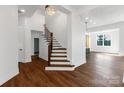 Elegant staircase featuring hardwood steps and a modern railing leading to the upper level of the home at 108 Augusta Ln, Shelby, NC 28150
