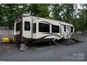 Columbus RV with easy ramp access, ready for comfortable living and travel adventures at 114 Redwood Trl, Mount Gilead, NC 27306