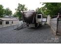 Columbus RV parked on gravel, features easy-access ramp and ample parking space at 114 Redwood Trl, Mount Gilead, NC 27306
