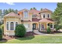 Elegant two-story home boasting a charming facade, manicured lawn and symmetrical design at 149 Vista Bluff Ln, Mooresville, NC 28117