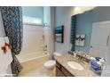 Bathroom featuring a shower-tub combo and granite countertops at 152 Asmodean Ln, Troutman, NC 28166