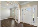 Bright foyer with hardwood floors, glass-paneled doors and an office space at 2097 Saddlebred Dr, Iron Station, NC 28080