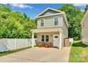 Charming two-story home with a welcoming front porch and concrete driveway at 2662 14Th Ne St, Hickory, NC 28601