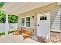 Inviting front porch with stone accents and a cozy seating area at 2662 14Th Ne St, Hickory, NC 28601