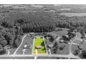 Aerial view of property highlighting lot size, surrounded by lush greenery and neighborhood at 2694 Rock Dam Rd, Lincolnton, NC 28092