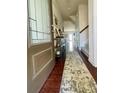 Inviting entryway with hardwood floors, a decorative rug, and access to a staircase at 2769 Sawbridge Ln, Gastonia, NC 28056