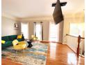 Bright living room featuring hardwood floors, large windows, and stylish furnishings at 3114 Luke Crossing Dr, Charlotte, NC 28226