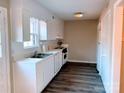 Bright kitchen with white cabinets, wood floors, and modern appliances at 4754 Old Lantern Way, Charlotte, NC 28212