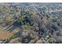 Scenic aerial view of a neighborhood surrounded by mature trees and lush landscaping at 529 Winding Way Way # 8, Belmont, NC 28012