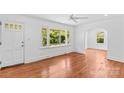 Bright living room with hardwood floors, large windows, and an open doorway at 564 Greenway Dr, Statesville, NC 28677