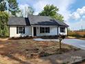 Charming single-story home with a new driveway, a mailbox, and black window shutters at 723 Taylor St, Rock Hill, SC 29730