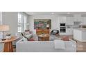 Bright, open-concept living room featuring stylish furnishings and contemporary decor that exudes warmth and comfort at 9212 Delancey Ln # 63, Concord, NC 28027