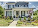 Beautiful two-story home with landscaped front yard and inviting covered porch at 9507 Pointer Rd, Huntersville, NC 28078