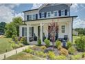 Beautiful two-story home with landscaped front yard and welcoming covered porch at 9507 Pointer Rd, Huntersville, NC 28078