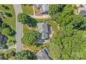 Stunning aerial view of home showcasing lush landscaping and private backyard at 10500 Kilmory Ter, Charlotte, NC 28210