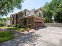 Beautiful two-story home with a brick exterior, attached garage, and well-maintained landscaping at 10500 Kilmory Ter, Charlotte, NC 28210