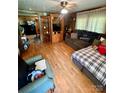 Inviting living room featuring wood-look floors and comfortable seating arrangement at 302 Margarette Ave, Belmont, NC 28012
