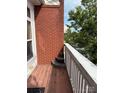 Charming balcony with a brick facade and wooden flooring, offering a scenic outdoor view at 6112 Creft Cir, Indian Trail, NC 28079