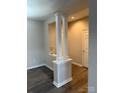 Open living space with decorative columns and neutral paint, offering flexible design options at 6112 Creft Cir, Indian Trail, NC 28079